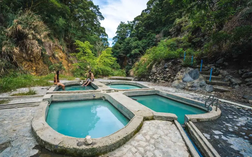 Tiered mineral pools at Baslay Hot Spring in the Dauin highlands