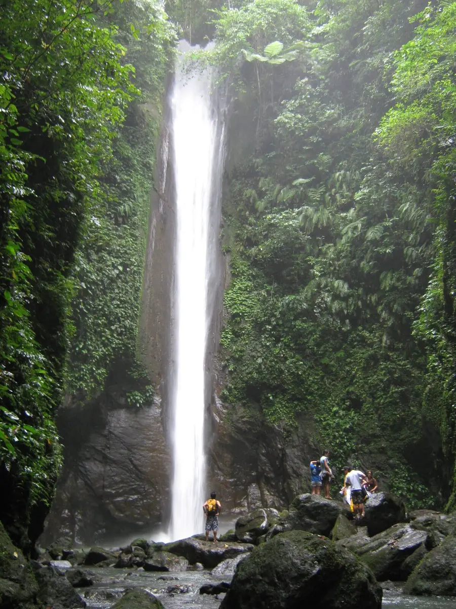 Tall Casaroro Falls in a forested gorge